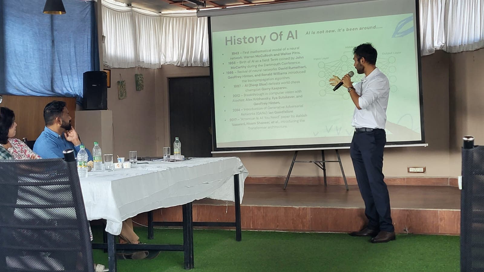 Jitthen presenting the history of AI to attendees at Stratovate Ignite